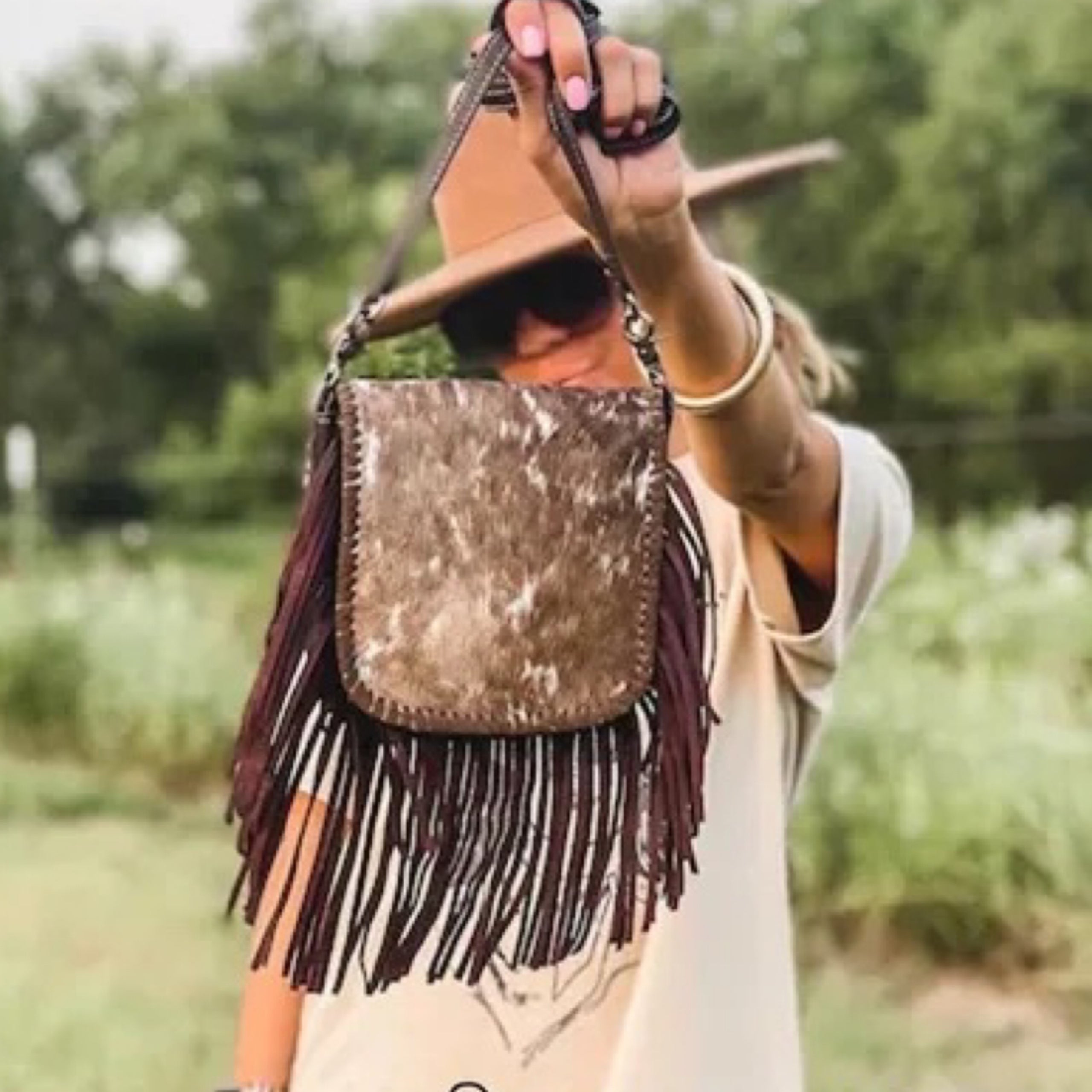 Cowhide fringe crossbody on sale